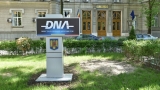 Un polițist care a cerut mită 300.000 de euro ridicat de DNA! Iată ce a promis