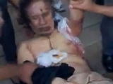 Cadavrul însângerat al lui Gaddafi, batjocorit de rebeli. Imagini şocante! VIDEO 